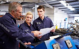 stock photo engineer teaching apprentices to use tube bending machine 165341906 2