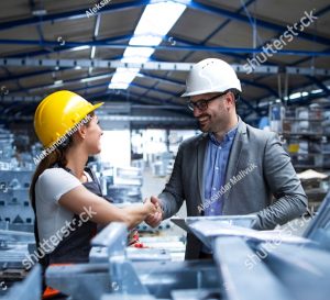 stock photo factory manager visiting production line and congratulating worker on promotion for hard work and 1790288324 1
