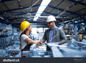 stock photo factory manager visiting production line and congratulating worker on promotion for hard work and 1790288324