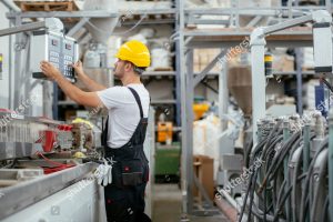 stock photo factory worker man working on the cables and wires 1561658359