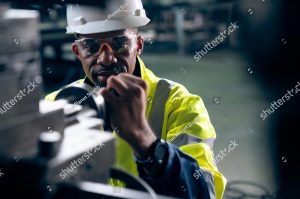 stock photo factory worker or engineer do machine job in adept manufacturing workshop industrial people and 2133600337