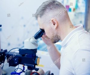 stock photo industrial worker use microscope for precision plasma welding at modern factory floor concept 2083296271