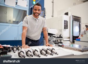 stock photo portrait of male engineer with cad drawings in factory 1067929823