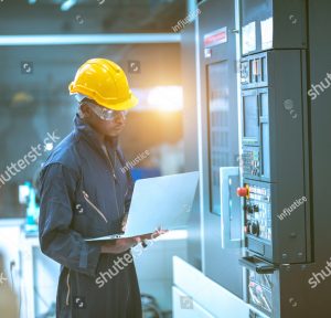 stock photo the egineer in the industial working with computer control the machine 1937967970 1 1