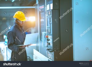stock photo the egineer in the industial working with computer control the machine 1937967970