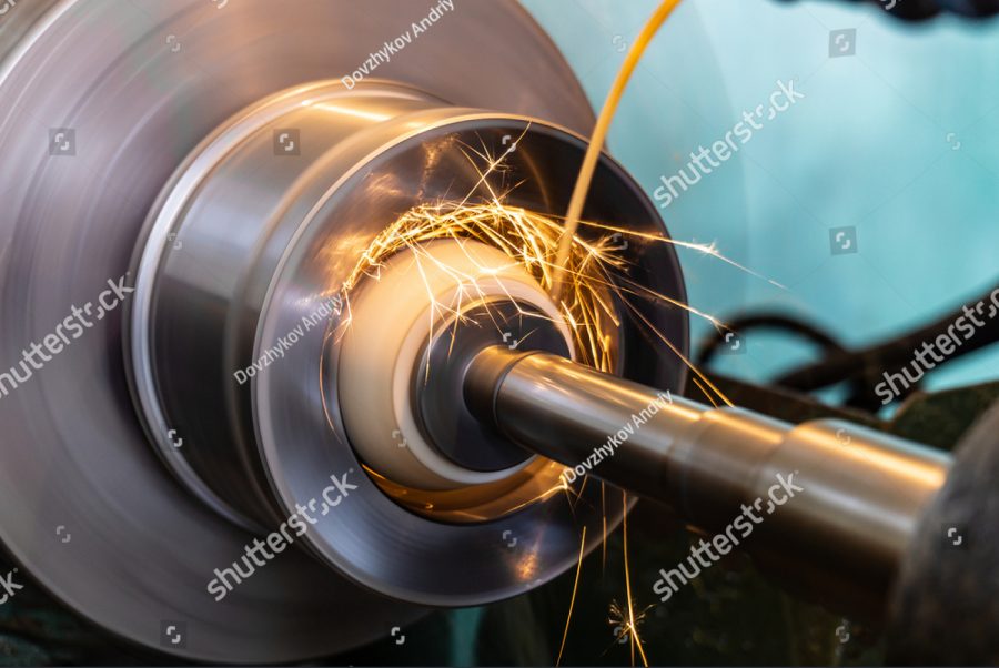 stock photo grinding the end of the workpiece with an abrasive wheel on a circular grinding machine 1886154205